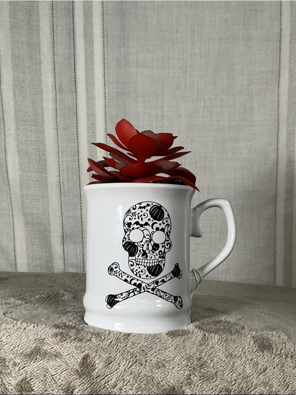 White Ceramic Skull & Crossbones Coffee Mug with Red Faux Accent Plant